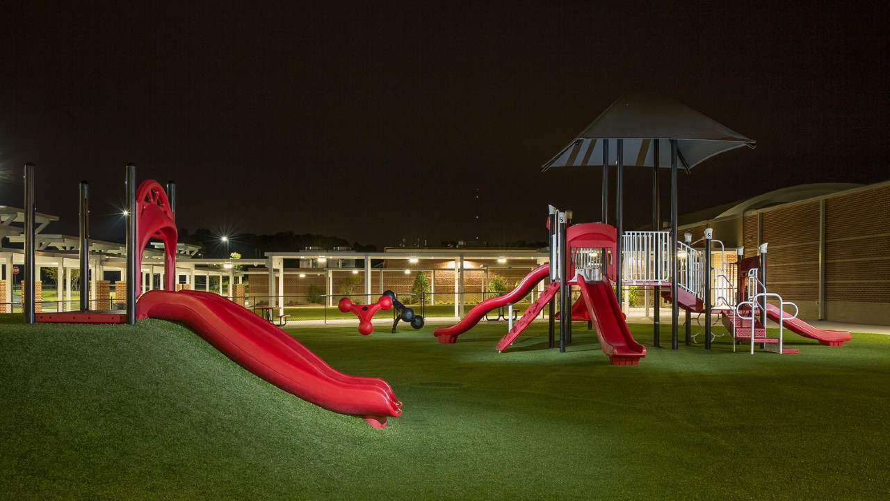 Nighttime artificial turf playground by Southwest Greens Vancouver (Second Generation Landscapes)